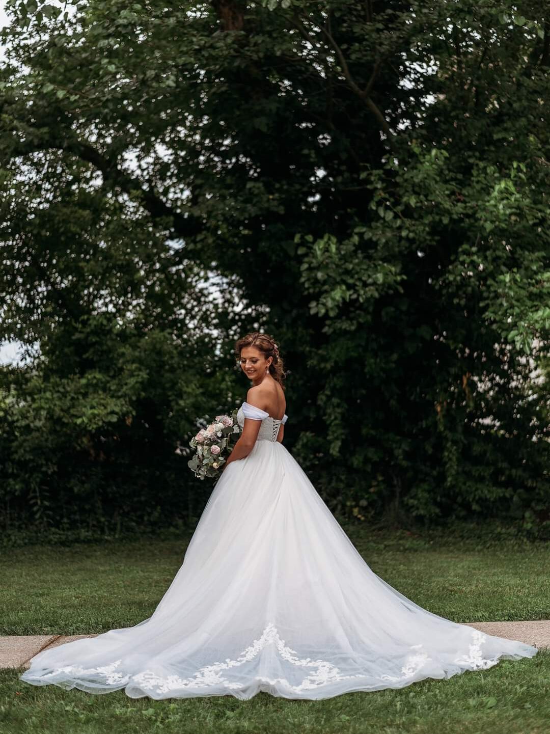 bride in beautiful custom tailored bridal gown